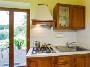 a kitchen with a sink and a stove top oven at Farmhouse in Ville di corsano siena at the centre in Corsano