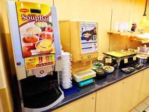 a soda machine is on a counter in a kitchen at Super Hotel Akihabara Suehirocho in Tokyo