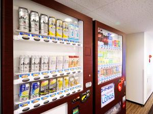 a vending machine with soda and sodas at Super Hotel Akihabara Suehirocho in Tokyo