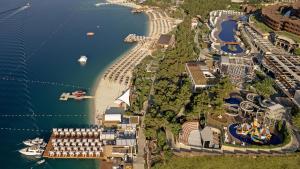 an aerial view of a marina with boats in the water at Titanic Luxury Collection Bodrum in Guvercinlik