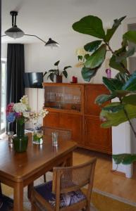 a dining room with a wooden table and a dresser at Apartment Luk in Furth im Wald