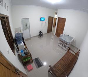 an overhead view of a living room with a tv in a room at Bovalia Homestay Jogja in Seturan