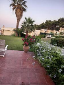 A garden outside Yades elegant villa 2 minutes away from the beach