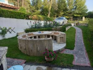 A garden outside Yades elegant villa 2 minutes away from the beach
