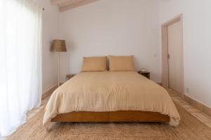 Postel nebo postele na pokoji v ubytování Vale da Cassiopeia