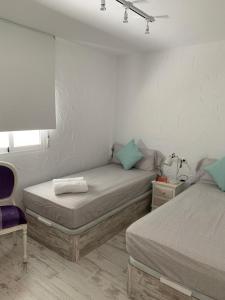 Postel nebo postele na pokoji v ubytování Villajoyosa Sweet