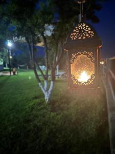 a lantern hanging in a park at night at Nikitihouse Apartments 1 in Nikiti