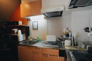 Kuchyň nebo kuchyňský kout v ubytování E JOY INN-West Shinjuku Branch