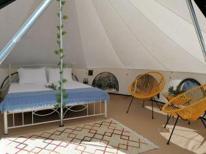 Postel nebo postele na pokoji v ubytování Unique Glamping Suite