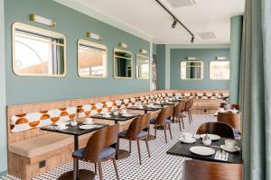 Un restaurante u otro lugar para comer en Hotel D Bulle - La Gruyère