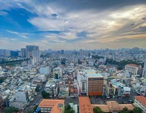 a view of a city with a lot of buildings at SOHO 23 Floor Stunning City View Apartment Near Bui Vien Ben Thanh in Ho Chi Minh City
