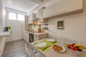 Kuchyň nebo kuchyňský kout v ubytování BnButler - Archimede 53 - Bright Studio
