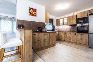 Η κουζίνα ή μικρή κουζίνα στο Barackvirág Apartmanház +17 φωτογραφίες