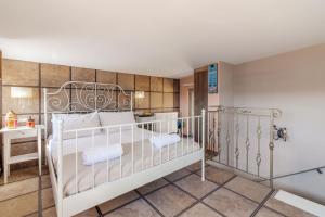 a bedroom with a large white bed in a room at Serenity house near Heraklion in Stavrákia