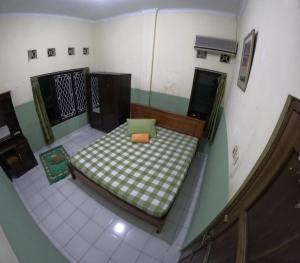 - Vistas a una habitación con cama en Omah 430 Suryowijayan, en Ngabean