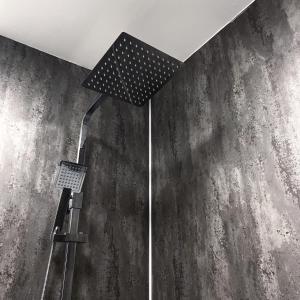 a shower in a room with a wall at The Kings Head Inn, home of The Acle Steak in Acle