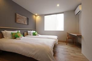 Un pat sau paturi într-o cameră la AKATSUKI