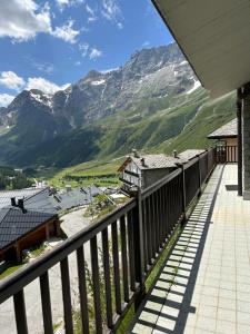 a balcony with a view of a mountain at La marmotta bianca ski in out- CIR 0370 in Breuil-Cervinia