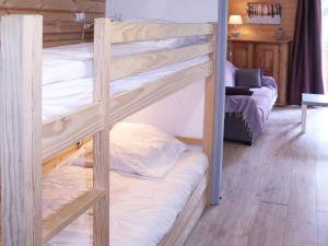 a couple of bunk beds in a room at Studio Les Orres, 1 pièce, 4 personnes - FR-1-322-339 in Les Orres