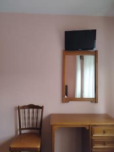 TV a/nebo společenská místnost v ubytování Hostal La Parrilla + 5 fotografií