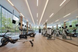 a gym with treadmills and elliptical machines at InterContinental Hangzhou Liangzhu, an IHG Hotel in Hangzhou