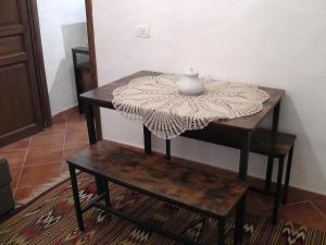 a table with a vase sitting on top of it at Sardinia Experience in Villamassargia +20 photos