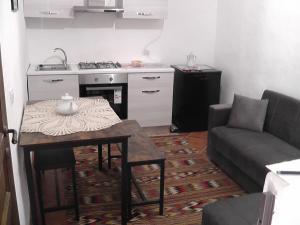 a living room with a couch and a table at Sardinia Experience in Villamassargia