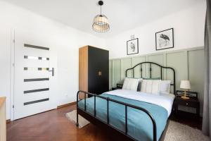 Voodi või voodid majutusasutuse Ratusz Arsenał Modern Apartment toas