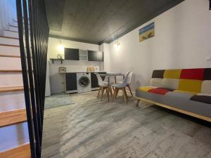 a living room with a couch and a table at LaVoiLaNoi in Mangalia