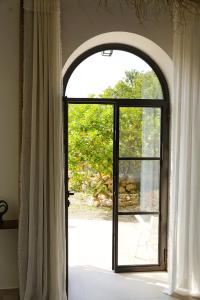 an open window with a view of a yard at Dimora Storica Villa Pasquale Capri in Capri
