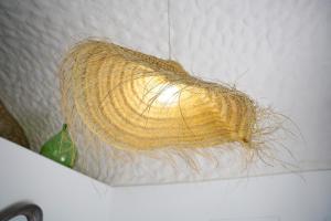 a bunch of hair hanging from a wall at Dimora Storica Villa Pasquale Capri in Capri