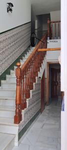 a staircase in a house with wooden railings at Apartamento Don Manuel in Rincón de la Victoria