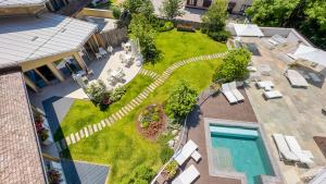 an aerial view of a backyard with a swimming pool at Blu Hotel Natura & Spa - Adults Only in Folgaria