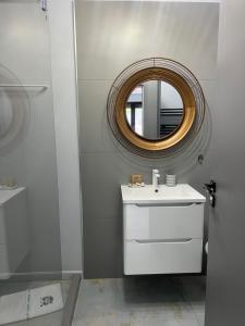 a bathroom with a white sink and a mirror at Lucky Number in Sinaia +19 photos