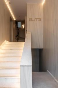 a staircase in a house with wooden walls at ELITE APARTMENTS in Thessaloniki
