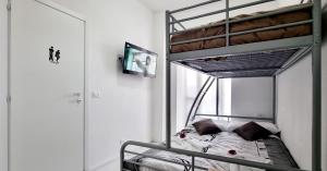 a bedroom with a bunk bed in a room at Guest Holiday Piave 4 in Reggio Emilia