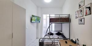 a bedroom with a bunk bed in a room at Guest Holiday Piave 4 in Reggio Emilia