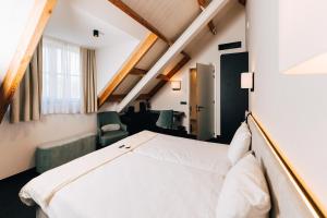 Postel nebo postele na pokoji v ubytování Factory Hotel