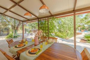 an outdoor dining room with a table with food on it at Casa Tina con piscina in San Vito dei Normanni