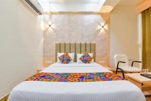 Postel nebo postele na pokoji v ubytování FabHotel Symphony Grand