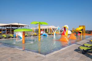 a pool with a water park with a water slide at Vila Gale Nep Kids in Beja