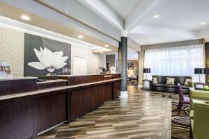 a lobby with a waiting room with a reception desk at La Quinta by Wyndham Myrtle Beach Broadway Area in Myrtle Beach