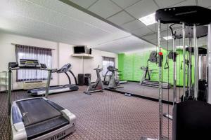 a gym with several tread machines in a room at La Quinta by Wyndham Myrtle Beach Broadway Area in Myrtle Beach