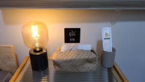 Postel nebo postele na pokoji v ubytování 山林間 - 露營 旅居 Camping & BNB in forests 預訂後請看訊息