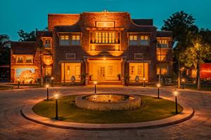 a house with a fountain in front of it at Tree Of Life Bhadrajun House, Jodhpur in Jodhpur