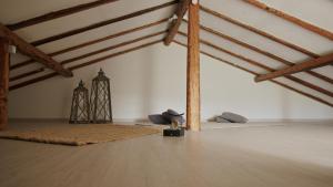 an attic room with a rug and wooden beams at Taormina 5 stars - Villa 5 minutes from the beach in Riposto