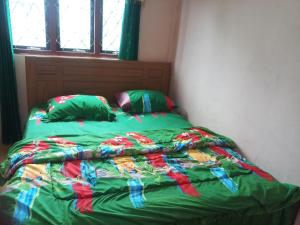 Un ou plusieurs lits dans un hébergement de l'établissement Todo Purang Tedeng Homestay