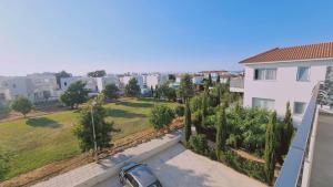 a view of a park from the balcony of a apartment at STAY Mediterranean Waves Apartment in Paralimni