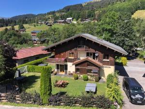 an aerial view of a house in the mountains at Chalet Aventure B&B Les Gets in Les Gets