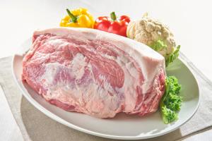 a piece of meat on a plate with vegetables at Hakata Excel Hotel Tokyu in Fukuoka